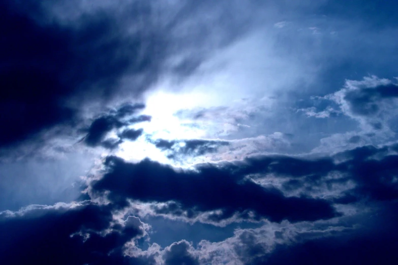 a view of the sky from below during cloudy weather