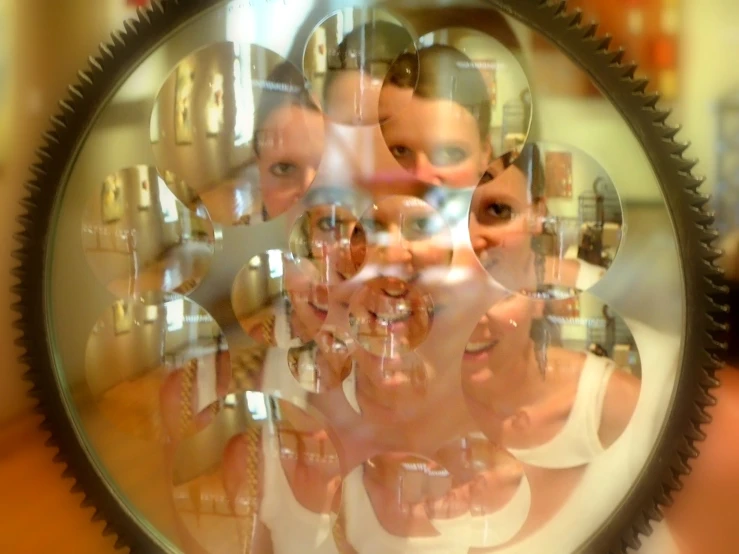 an image of an individual in the mirror with a woman's reflection