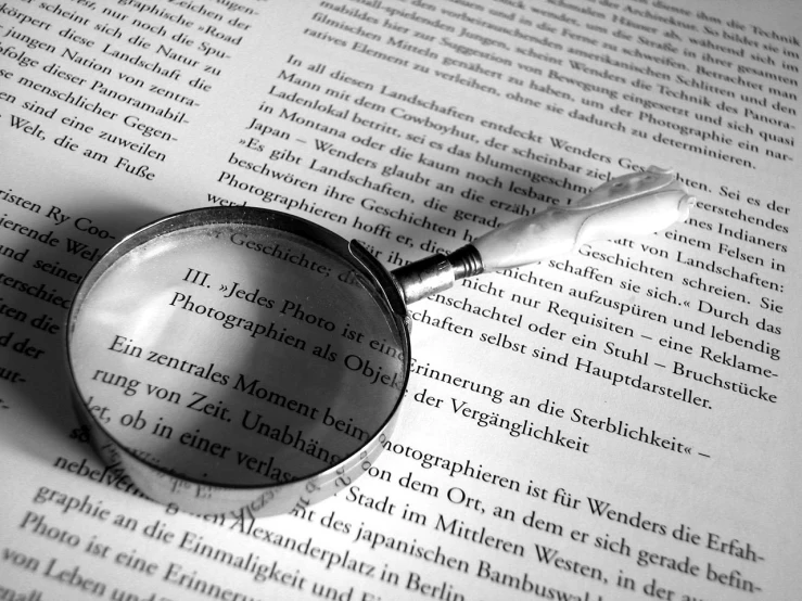 a magnifying glass over an open book