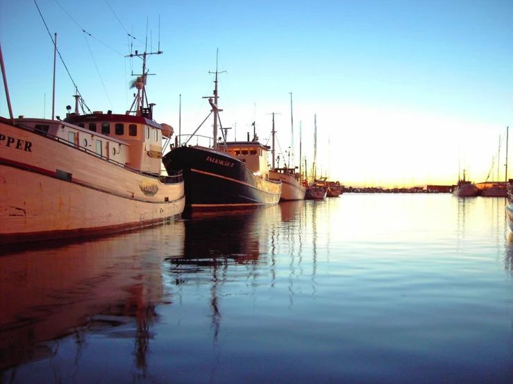 a few boats docked at a small harbor