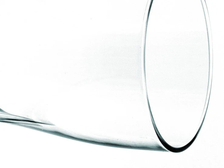 a large glass has been blown over by a white background