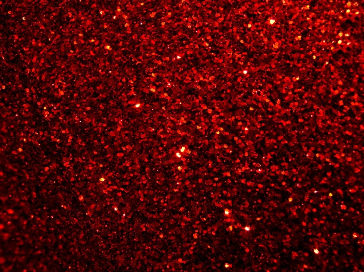 red glitter is shown in the dark