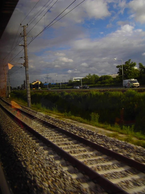 an over pass of railroad tracks next to some buildings