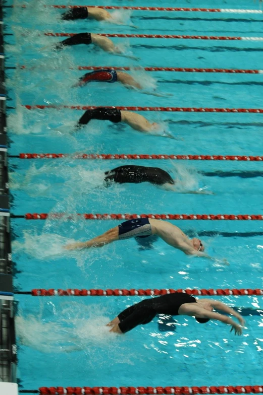 a bunch of swimmers in a swimming pool