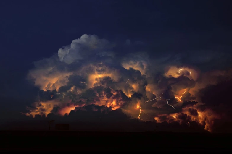 the clouds glow bright orange as they appear to be overcast