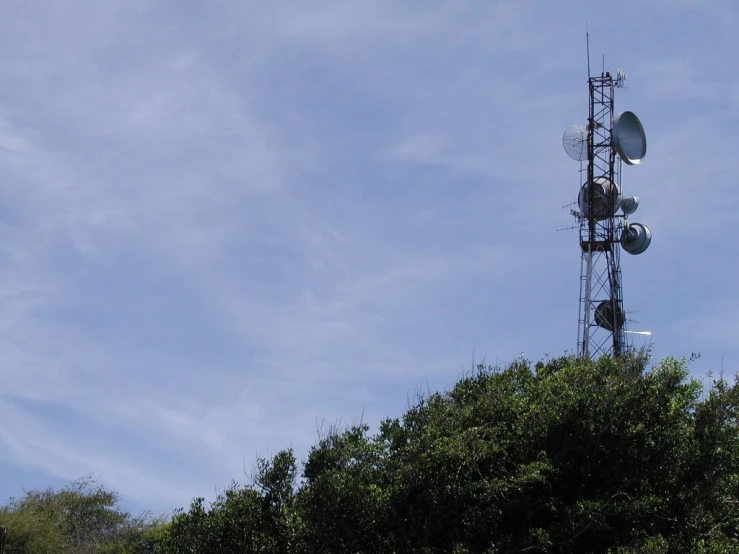 the tower contains three different antennas for communication