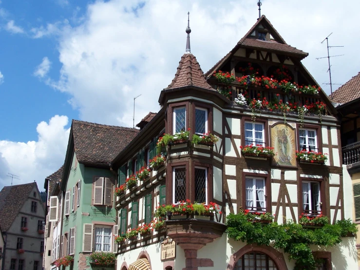 this old house has many beautiful flowers on it