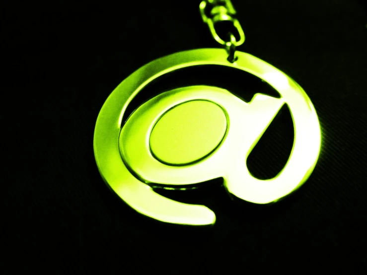 a glowing green logo is shown in the dark
