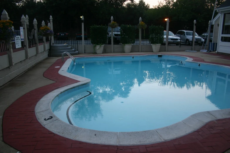 a long swimming pool in a suburban home