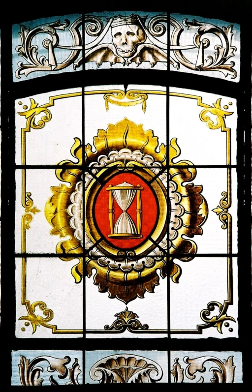 a very fancy stained glass window with an ornamental design