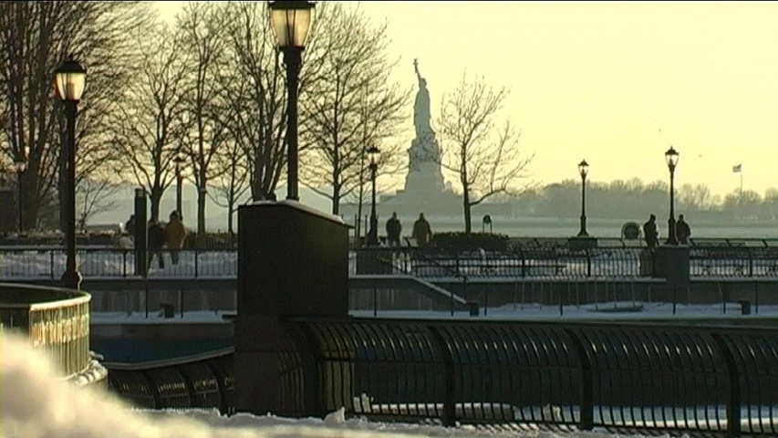 snowy benches with a view of the eiffel tower in background