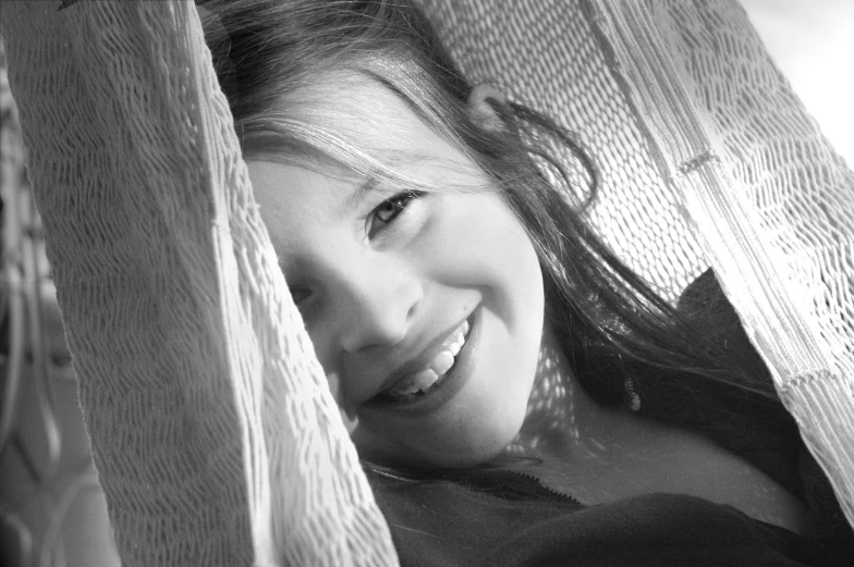 black and white image of a girl smiling