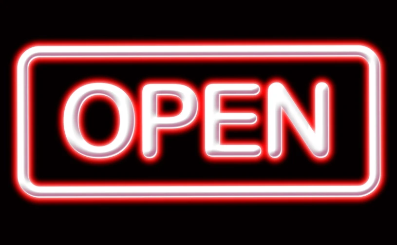 glowing red open sign with black background