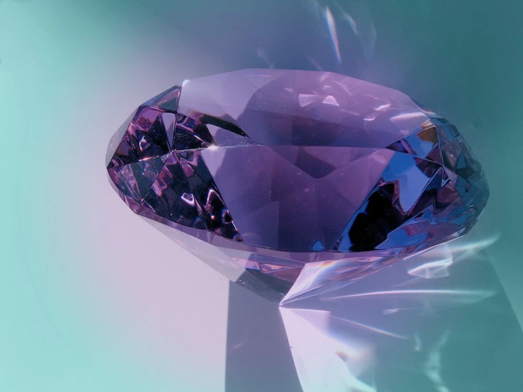 a purple diamond sitting on top of a counter