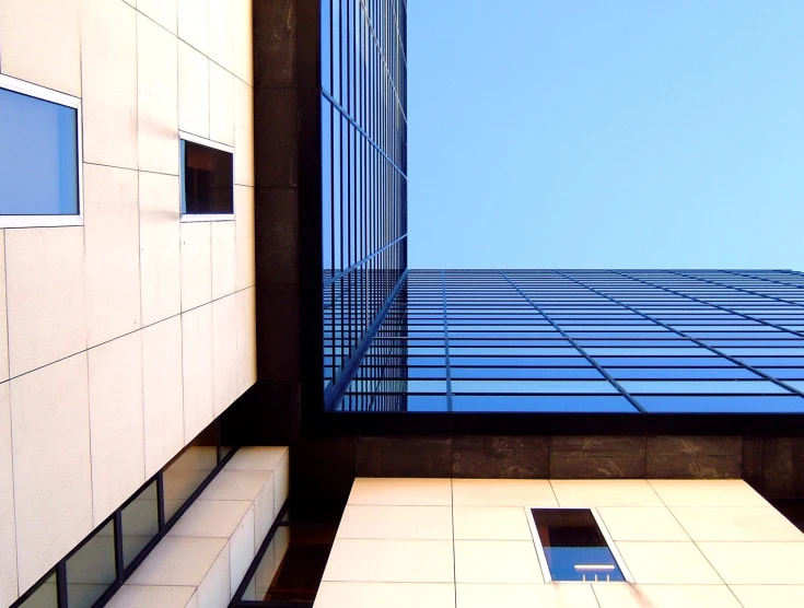 looking up at the high rise buildings from a courtyard