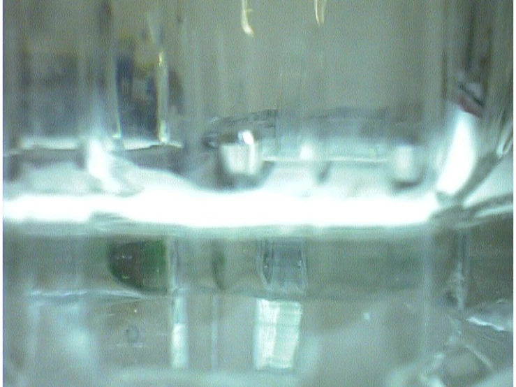 a close up of a glass filled with water