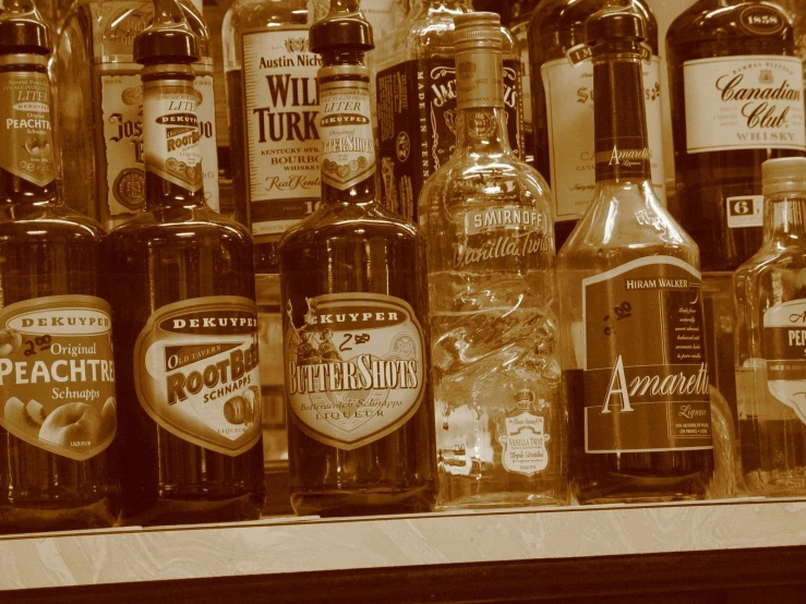 a variety of alcohol bottles in an liquor cooler