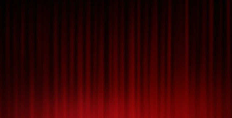 a dark red theater curtain with light reflection