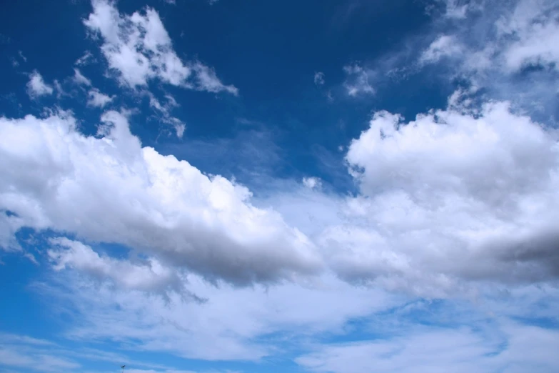 a beach with a kite flying in the sky