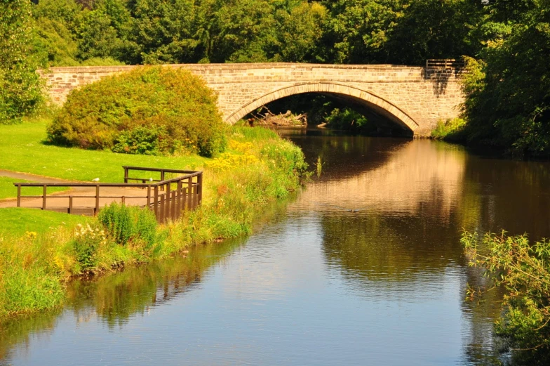 a small river running between two bridge bridges