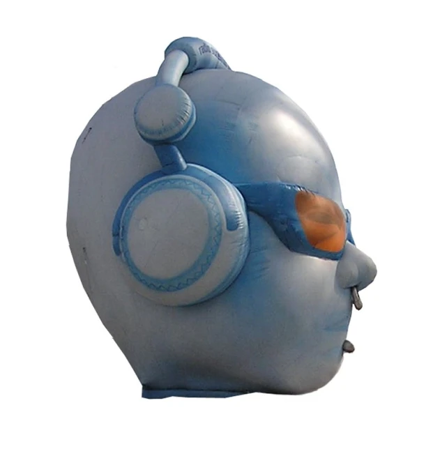 the head of a giant blue elephant balloon with headphones on it