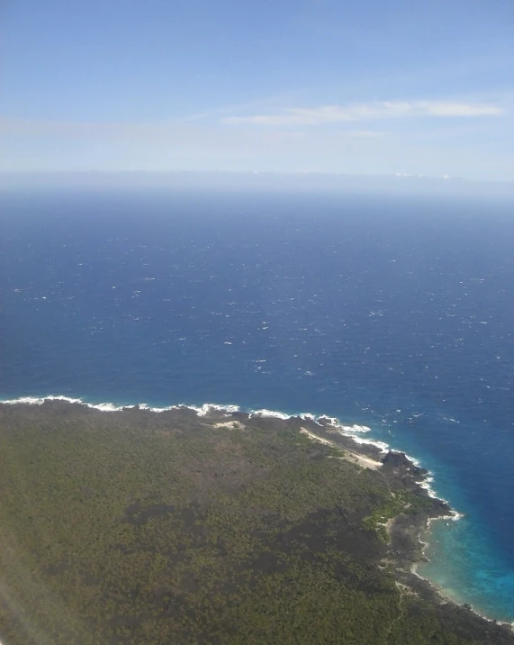 the ocean is very blue with white bubbles