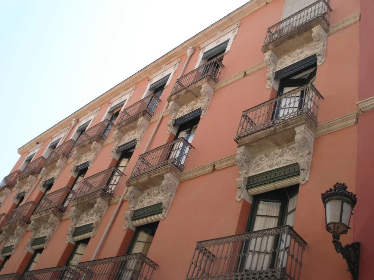 the windows and balconies of a multi - story building