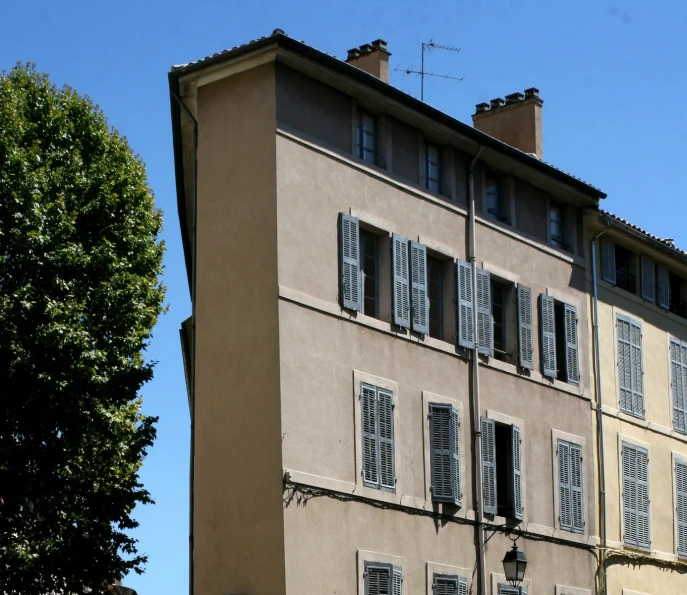 the building has two stories with white windows