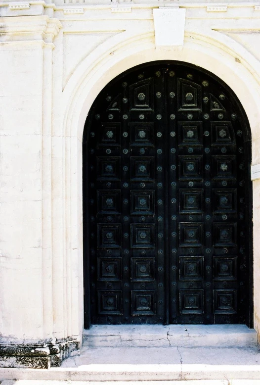 two doors that are near each other in the grass