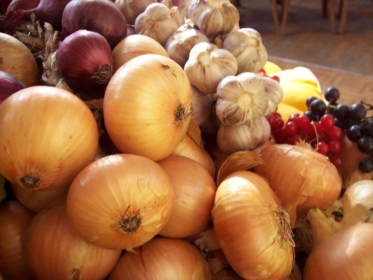 an assortment of onions are on display together
