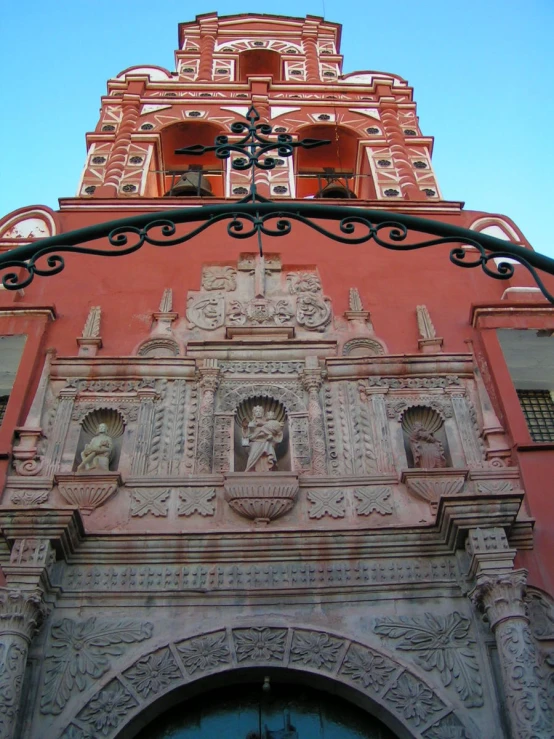 the entrance to an old building with a sculpture on top