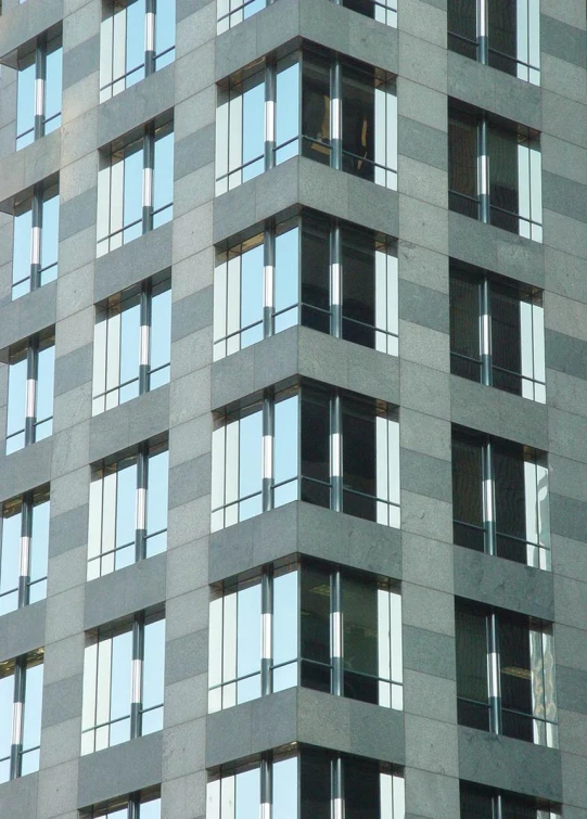 a large building with multiple windows in the daytime