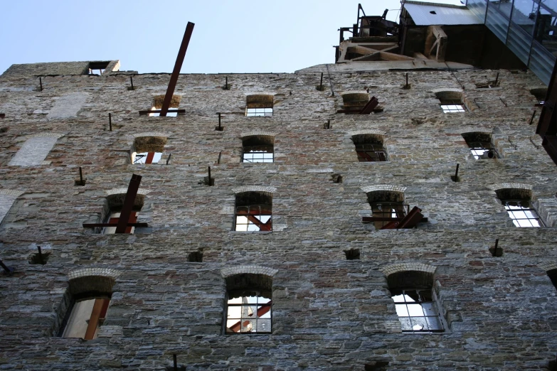 two windows are set in an old brick building