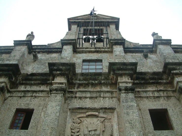 a tall building with lots of windows and a clock tower