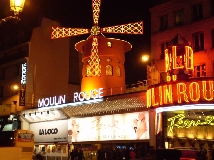 the moulin roule store with a sign lit up