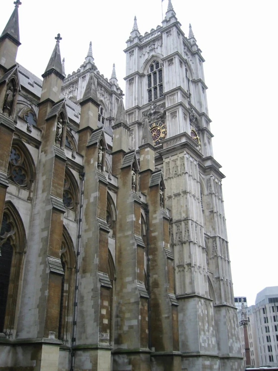 a tall old church with a clock on the front