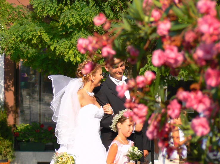 wedding party walking through the street