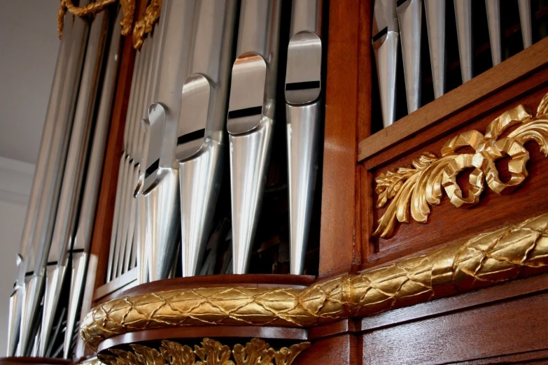 the metal pipes of a organ are gold