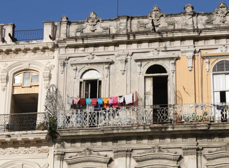 this is a po of clothes hanging on a balcony