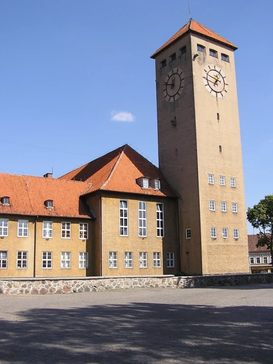 an outside clock on the front of a large building