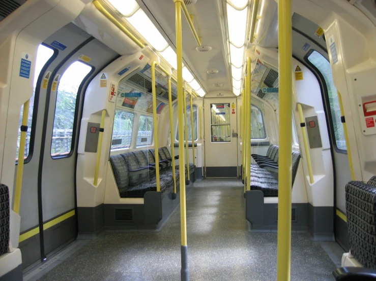 a view from the inside of an empty bus with chairs