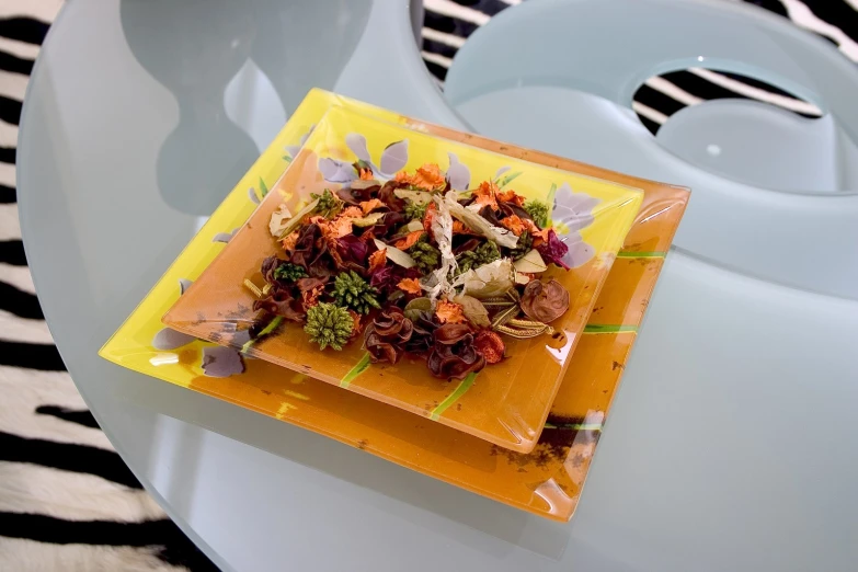 an abstract vase and plate display for food