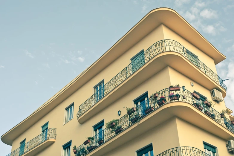 an apartment building has balconies and railings