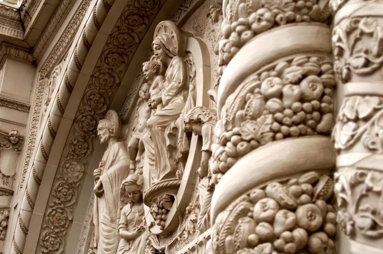 a very ornate building with sculptures all around it
