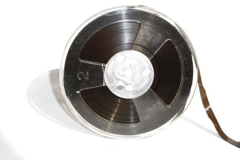 a reel of tape sitting on top of a white table
