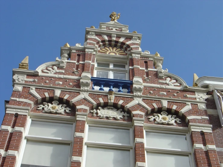 the corner of an elaborately designed brick building