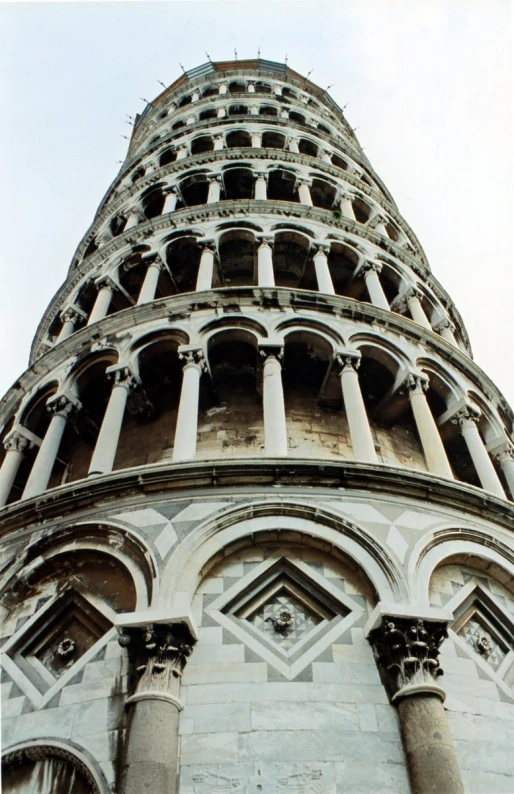 a view up into the side of a large tall tower