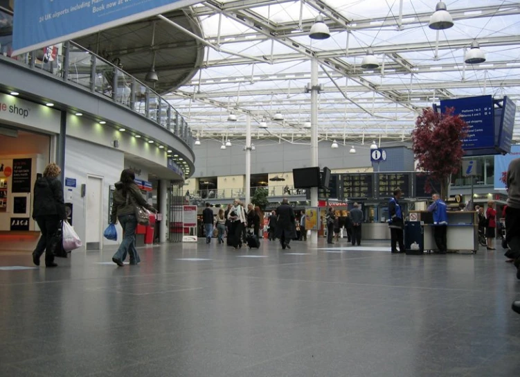 many people are walking through the terminal