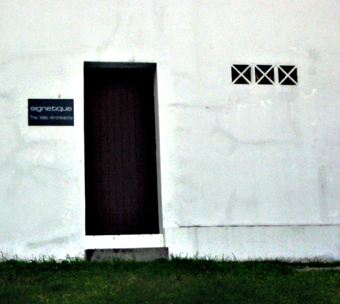 an apartment building that has a black and white door