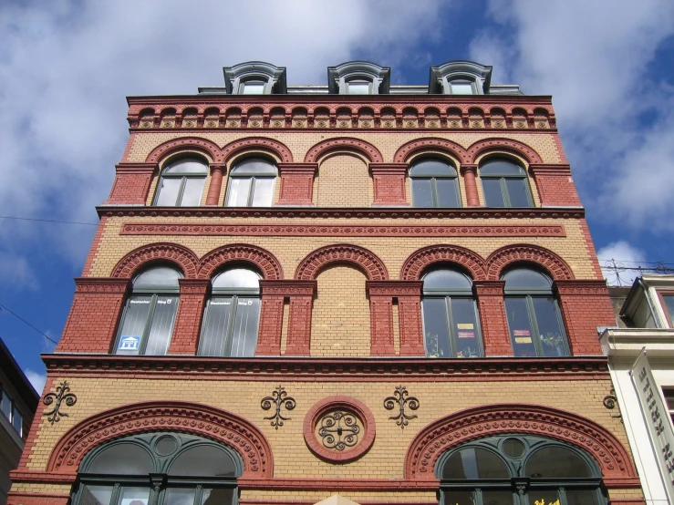 an old brick building with arched windows